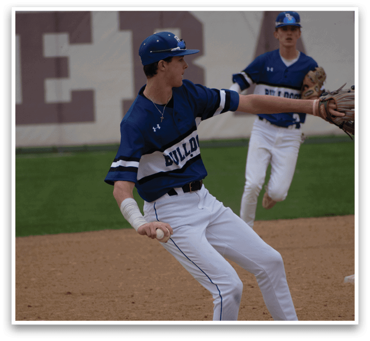 A baseball player wearing a blue and white uniform. Description generated by AI
