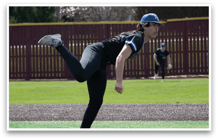 A baseball player in a black shirt and black pants is pitching a ball. Description generated by AI