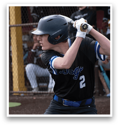 A baseball player in a black and blue uniform is holding a bat and getting ready to swing. Description generated by AI