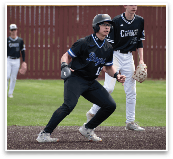 A baseball player wearing a black shirt and white shoes is running to first base. Description generated by AI