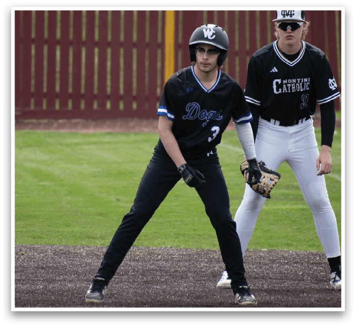 A baseball player in a black shirt and white pants is holding a baseball bat. Description generated by AI