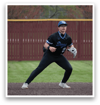 A baseball player in a black shirt and white shoes is playing on a baseball field. Description generated by AI