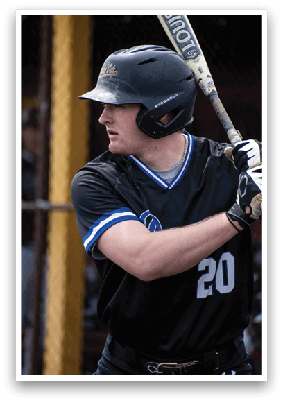 A baseball player wearing a black shirt and helmet. Description generated by AI