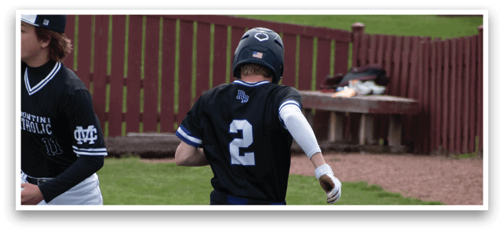 A baseball player in a black shirt and white pants is throwing a ball. Description generated by AI