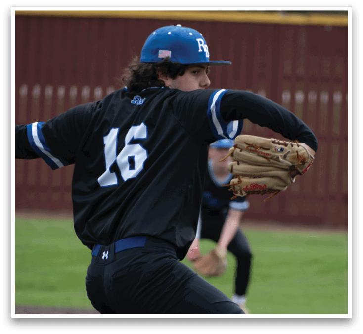 A baseball player in a black shirt and blue hat is throwing a ball. Description generated by AI