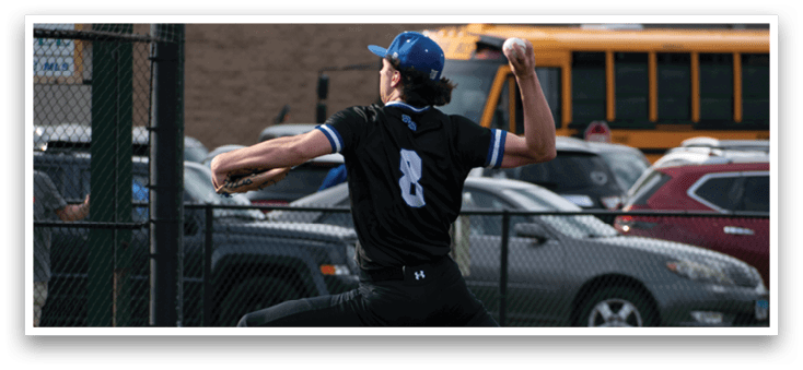 A baseball player in a black shirt and blue hat is pitching a ball. Description generated by AI