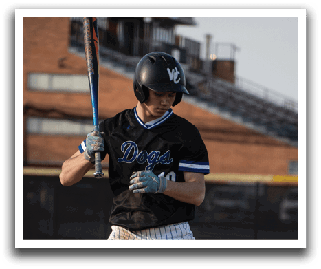 A baseball player in a black and white uniform is swinging a bat. Description generated by AI