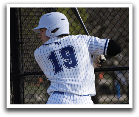 A baseball player in a white uniform is swinging a bat. Description generated by AI
