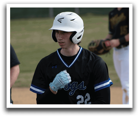 A baseball player wearing a black and white uniform with the number 22 on the back. Description generated by AI