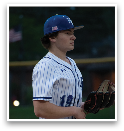 A baseball player wearing a blue and white striped uniform. Description generated by AI
