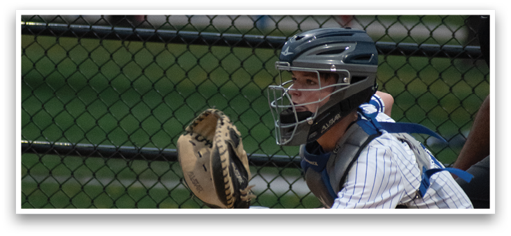 A baseball player wearing a helmet and catcher's mitt. Description generated by AI