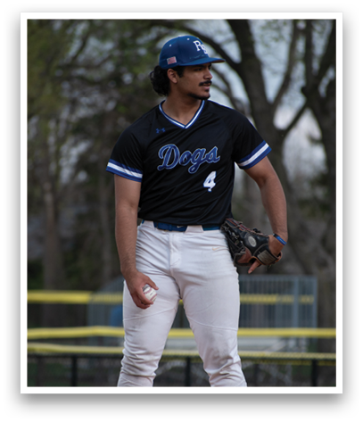 A baseball player wearing a black jersey with the number 4 on it. Description generated by AI