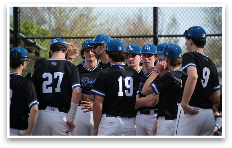 A group of baseball players wearing blue and black hats and jerseys. Description generated by AI