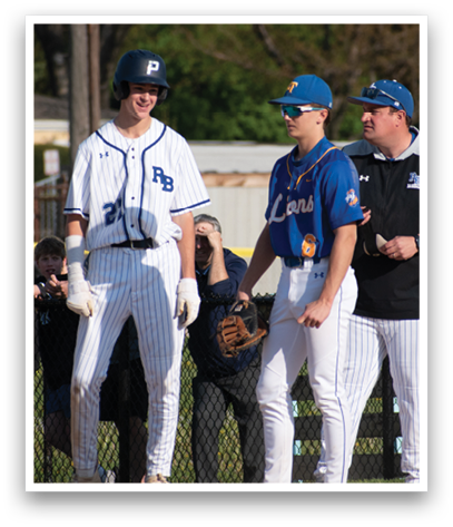 A baseball game is taking place with a group of men standing on the field. Description generated by AI