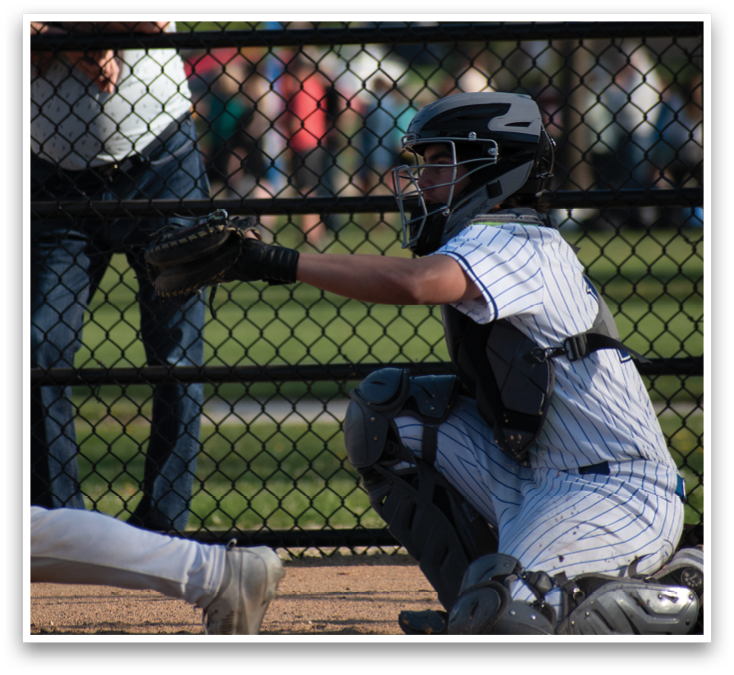 A baseball player is swinging a bat at a ball. Description generated by AI
