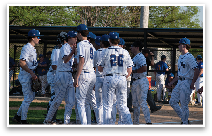 Baseball players wearing blue and white uniforms. Description generated by AI