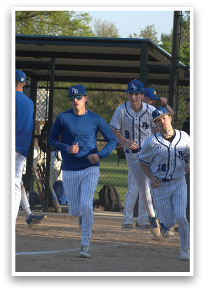 A baseball player running on the field. Description generated by AI