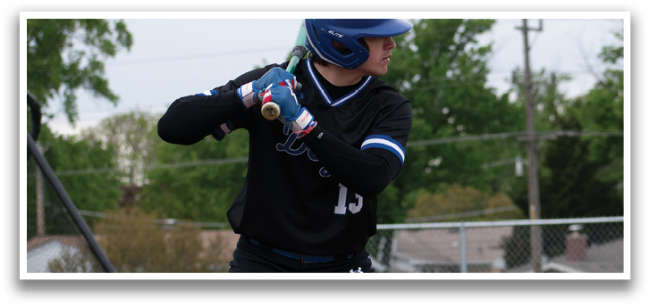 A baseball player in a blue helmet and black shirt is swinging a bat. Description generated by AI