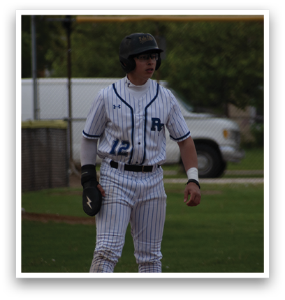 A baseball player wearing a blue and white uniform. Description generated by AI