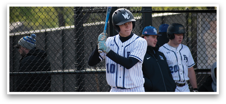 A baseball player holding a bat. Description generated by AI