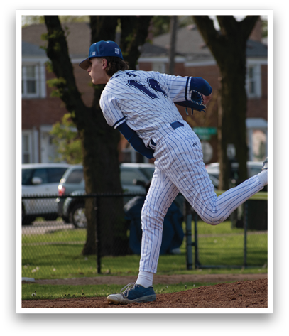 A baseball player in a blue and white uniform is pitching a ball. Description generated by AI
