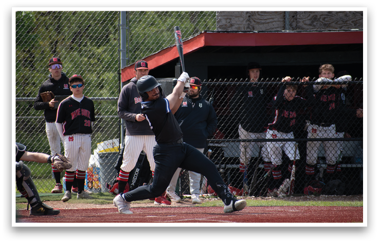 A baseball player is swinging a bat. Description generated by AI