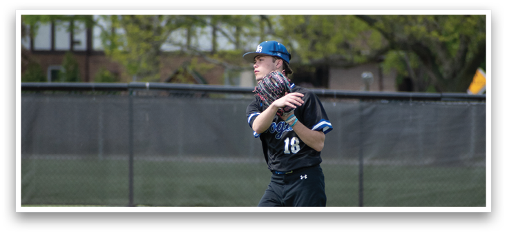 A baseball player wearing a black shirt and white shoes. Description generated by AI