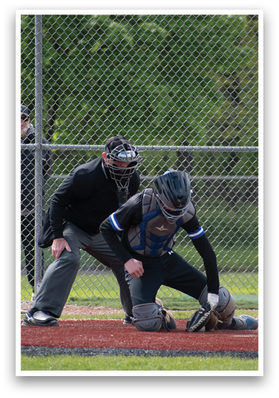 A baseball player is sliding into home plate. Description generated by AI