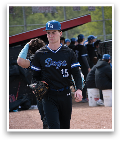 A man wearing a black jersey with the number 15 on it. Description generated by AI