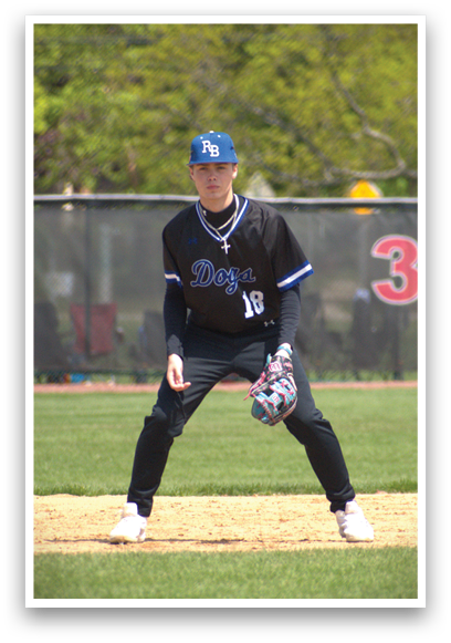A baseball player wearing a black shirt with the number 11 on it. Description generated by AI