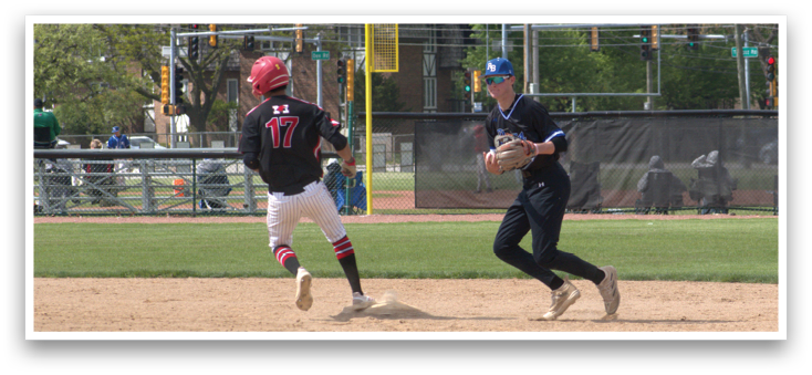 A baseball player is running to a base. Description generated by AI