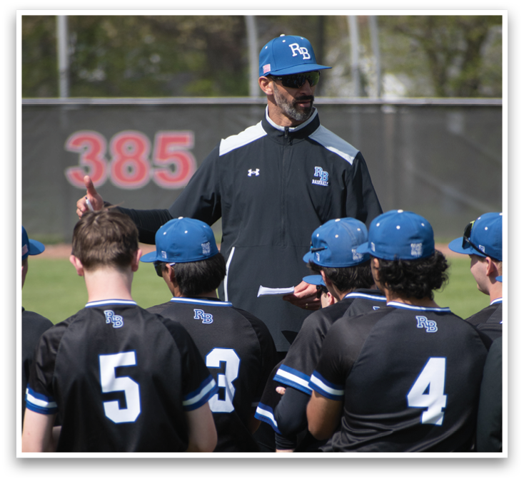 A group of baseball players wearing black shirts and blue hats. Description generated by AI