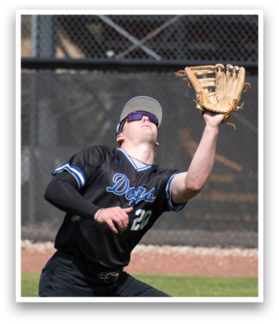 A baseball player wearing a black shirt and catching a ball. Description generated by AI