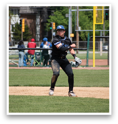 A baseball player in a black shirt and white pants is standing on a baseball field. Description generated by AI