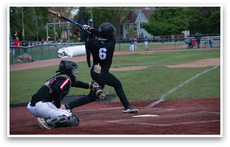 A baseball player is swinging a bat at a ball. Description generated by AI