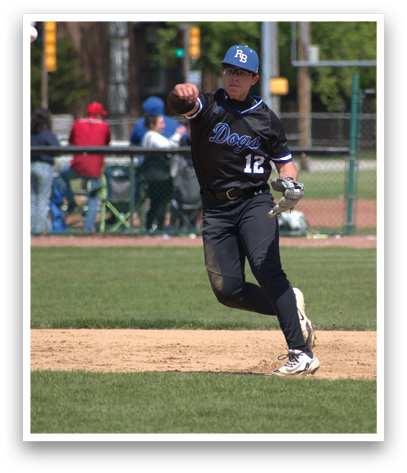 A baseball player wearing a black shirt and blue cap. Description generated by AI