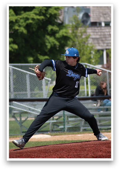 A baseball player wearing a black jersey with the number 11 on it. Description generated by AI