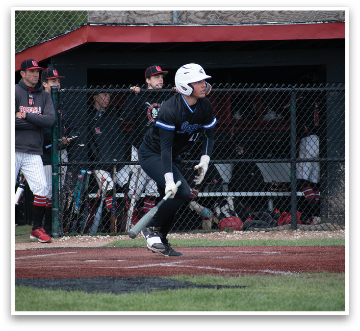 A baseball player is swinging a bat at a ball. Description generated by AI
