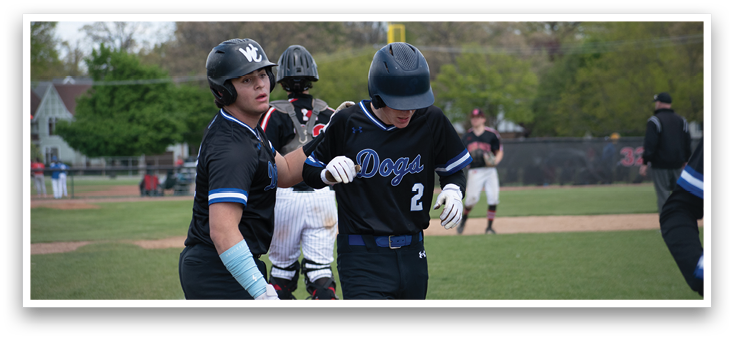 A baseball player wearing a black jersey with the number 2 on it. Description generated by AI