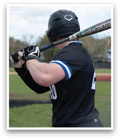 A baseball player in a black shirt and blue stripes is holding a bat. Description generated by AI