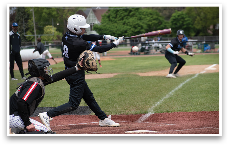 A baseball player is swinging a bat at a ball. Description generated by AI