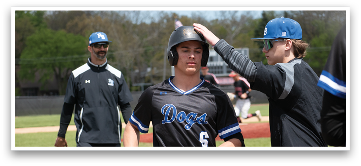 A baseball player wearing a black jersey with the number 6 on it. Description generated by AI