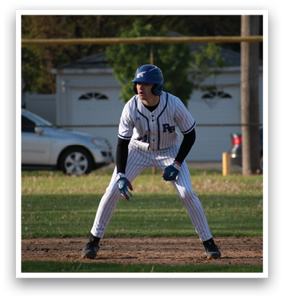 A baseball player wearing a blue helmet and white uniform. Description generated by AI