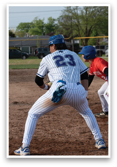 A baseball player with the number 23 on his back. Description generated by AI