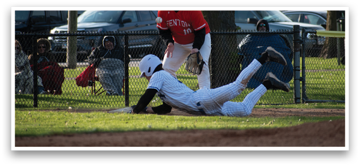 A baseball player sliding into home base. Description generated by AI