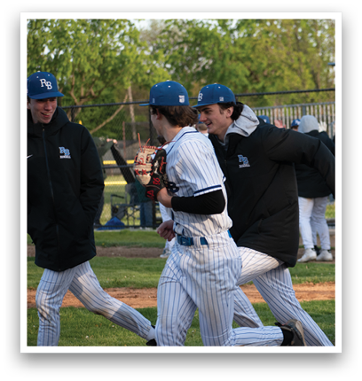 A group of baseball players on a field. Description generated by AI