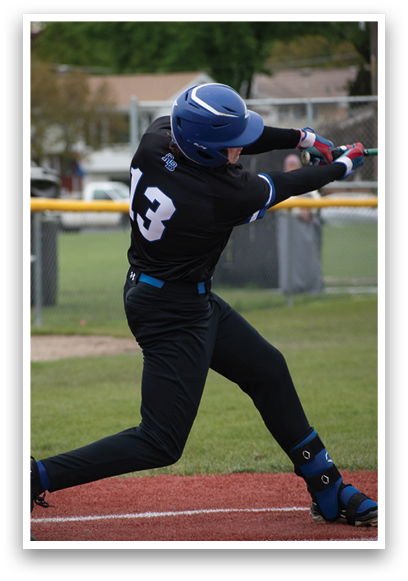 A baseball player in a black shirt and blue helmet is swinging a bat. Description generated by AI