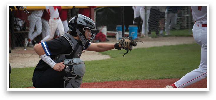 A baseball player is holding a bat and getting ready to hit the ball. Description generated by AI
