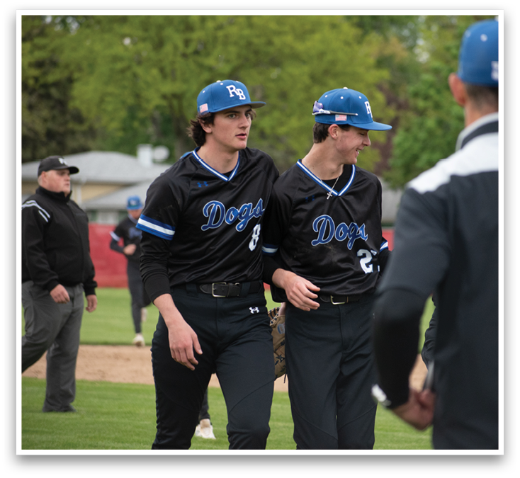 Two baseball players wearing black jerseys with the letter D on them. Description generated by AI