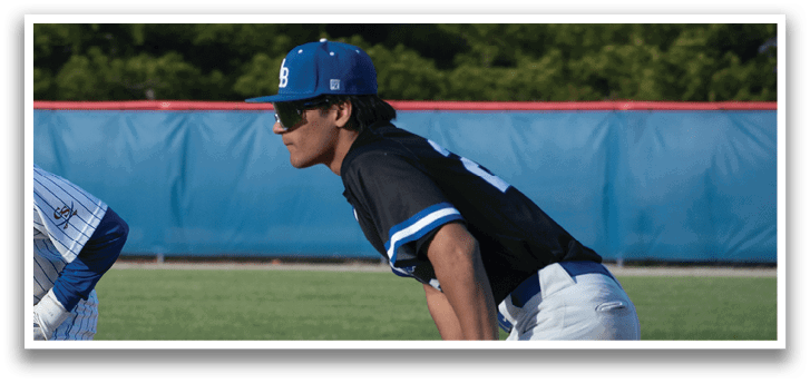 Two baseball players on a field. Description generated by AI